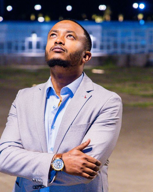 Teshome Girma at night under Addis city lights